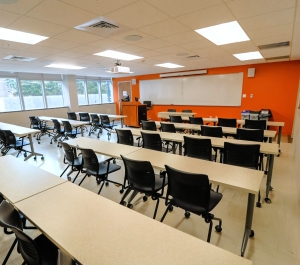 Classroom 123 empty table and chairs