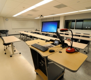 Classroom 172 empty with tables and chairs